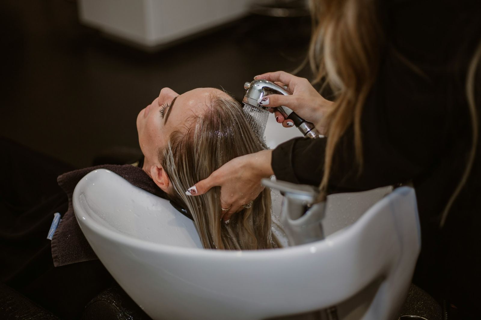 Mara cutting a client's hair